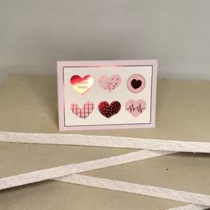 Ευχετήρια κάρτα Αγίου Βαλεντίνου που απεικονίζει καρδούλες